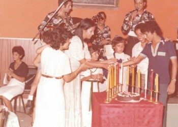 Ofra Haza and her brother Yair lighting a candle at the Bar Mitzvah of their brother Yehuda's son – 1977.